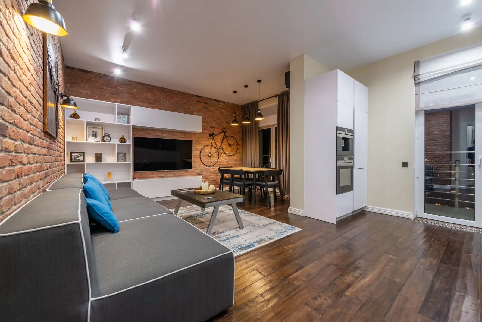 The open living space at Oldgate Works against its brick wall
