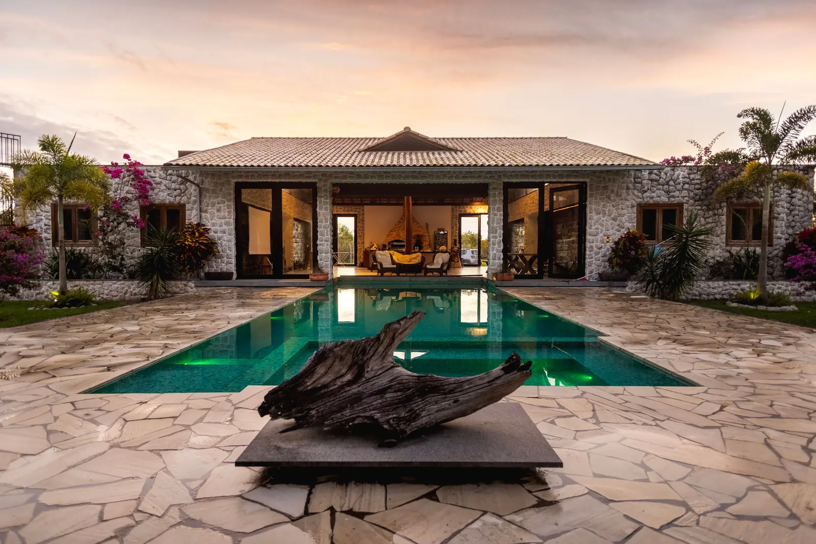 The pool at Saltmere Point between the show residence and the garden at the end of the day